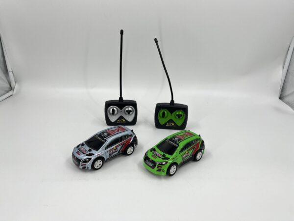 D Power – Rally Monster (Twin Pack) | RTR, 2 Radio Remote Control Car for Kids | 1:26 Scale, Dual Frequency Radio Channel, All Way Movement RC Car | White / Green Asst.